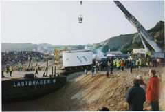 Loading of 'Janice' onto lorries begins. An aerial platform permits a top down view for management.